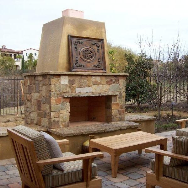 Built in Kingwood outdoor fireplace set with table and chairs