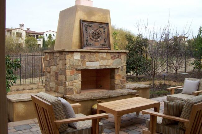 Built in Kingwood outdoor fireplace set with table and chairs