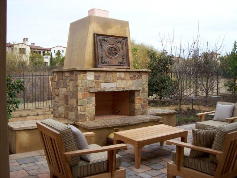 Built in Kingwood outdoor fireplace set with table and chairs