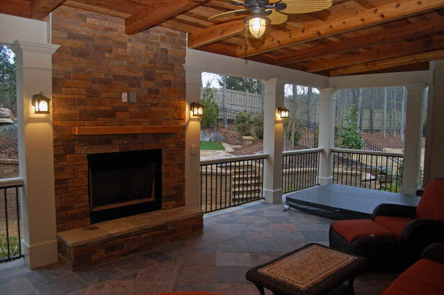 Houston outdoor kitchen ideas photo of covered porch and built in outdoor fireplace
