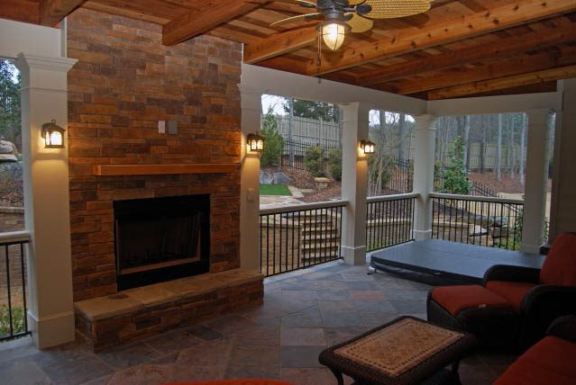 Houston outdoor kitchen ideas photo of covered porch and built in outdoor fireplace