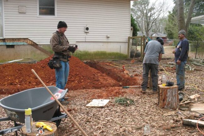 Deck project Humble TX underway clearing the land crew photo
