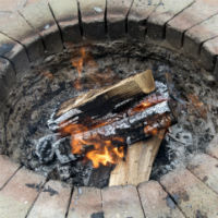 Fire burning in Houston outdoor fireplace