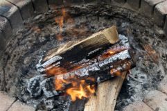 Fire burning in outdoor fireplace